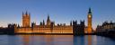 The Palace of Westminster at night seen from the south bank of the River Thames.